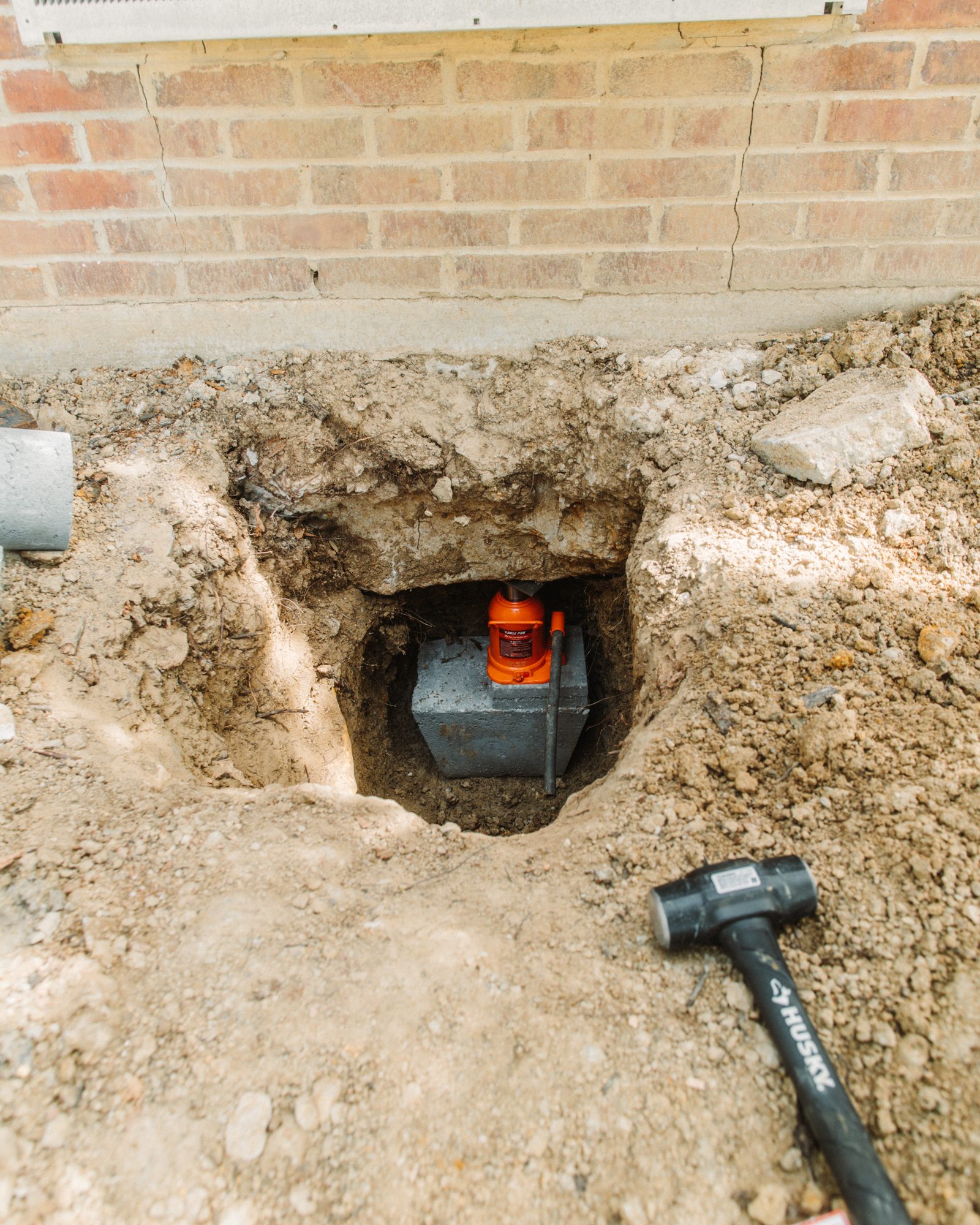 Concrete pier under footing, Imperial Foundation Repair job site in North Texas
