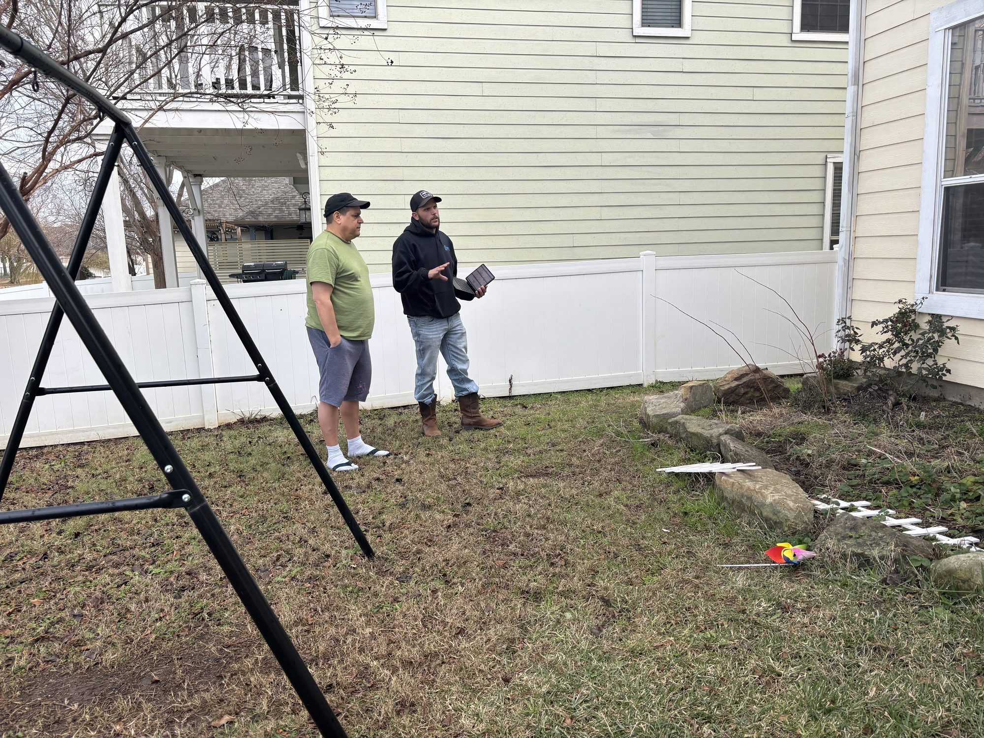 Owner explaining to homeowner, Imperial Foundation Repair job site in North Texas