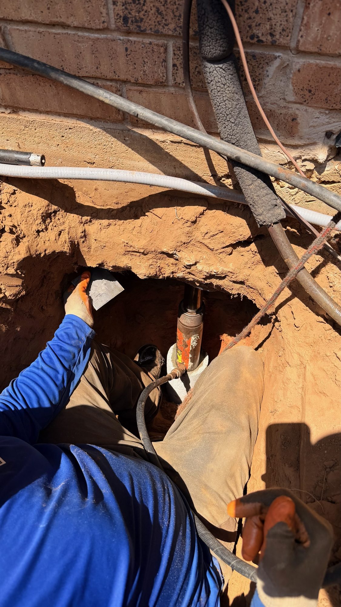 Pier set under slab closeup, Imperial Foundation Repair job site in North Texas