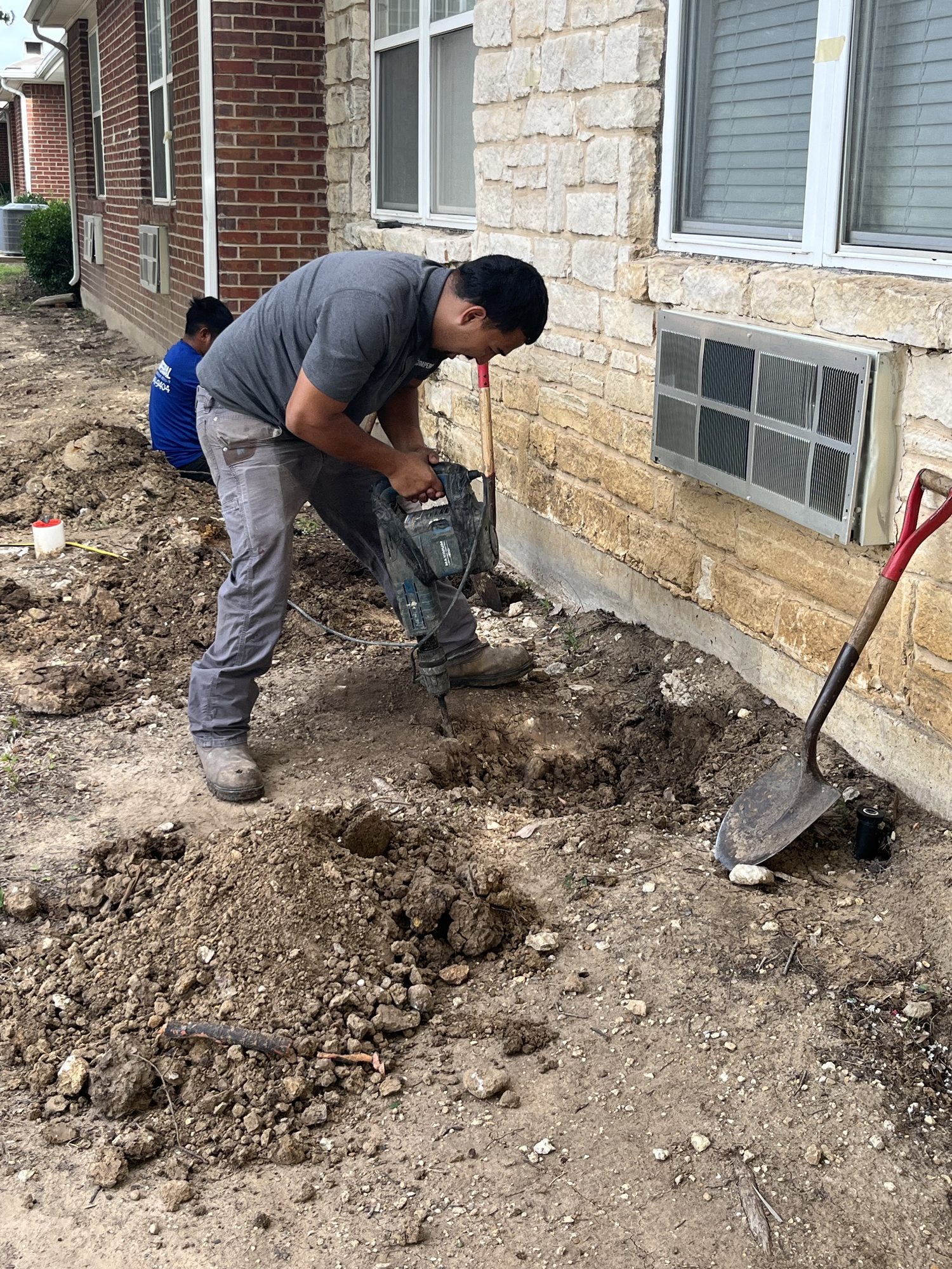 Crew excavation overhead, Imperial Foundation Repair job site in North Texas
