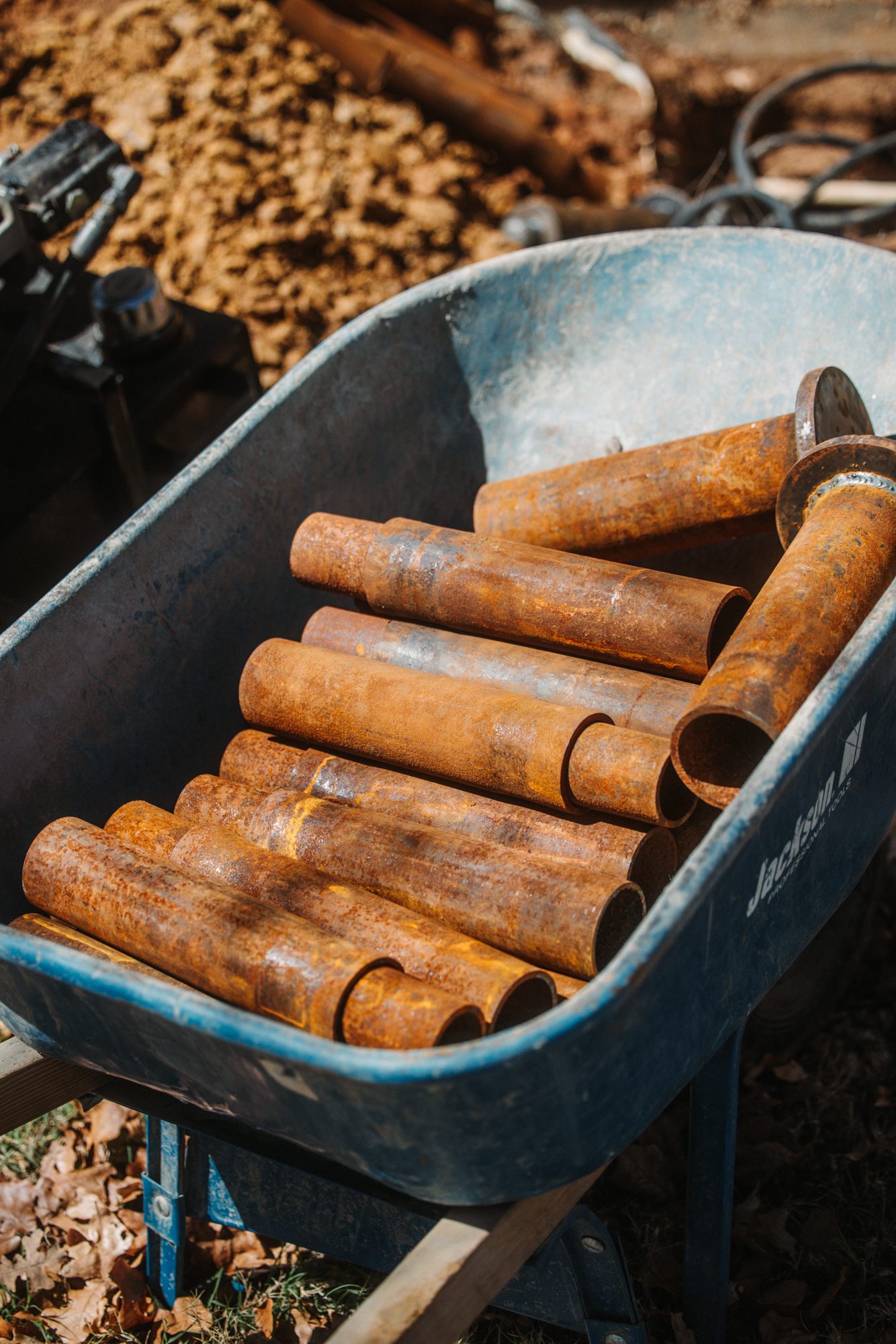 Steel pier sections wheelbarrow, Imperial Foundation Repair job site in North Texas