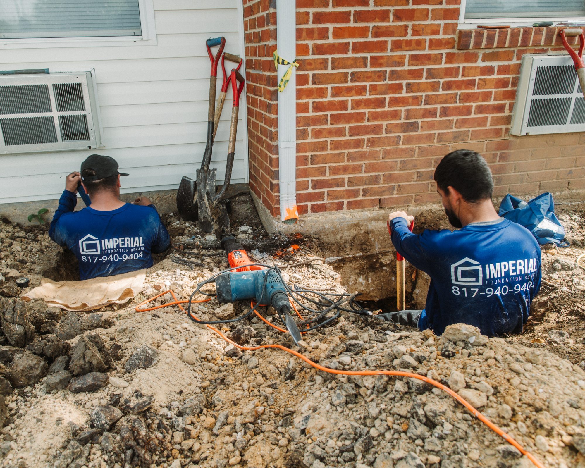 Pier install hydraulic ram two crew, Imperial Foundation Repair job site in North Texas