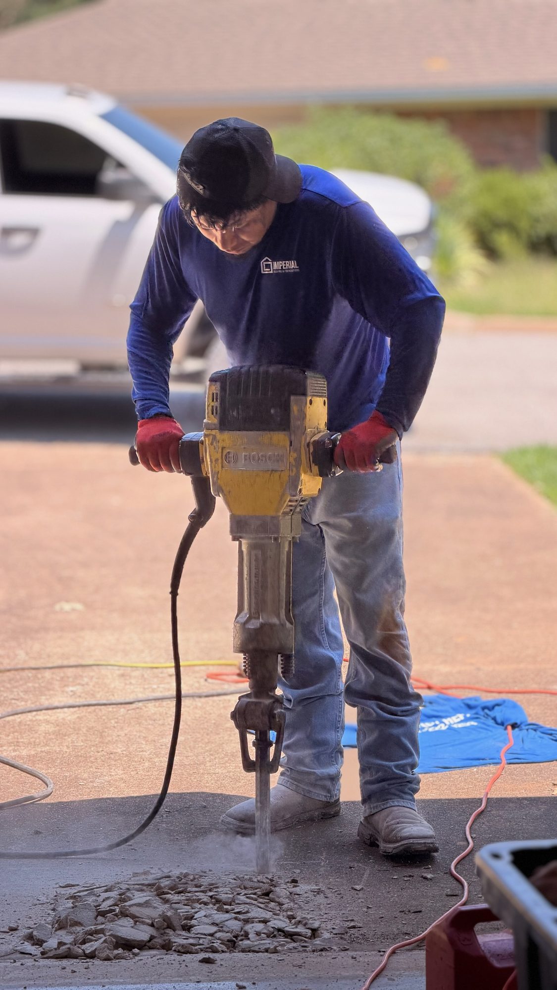 Jackhammer driveway, Imperial Foundation Repair job site in North Texas