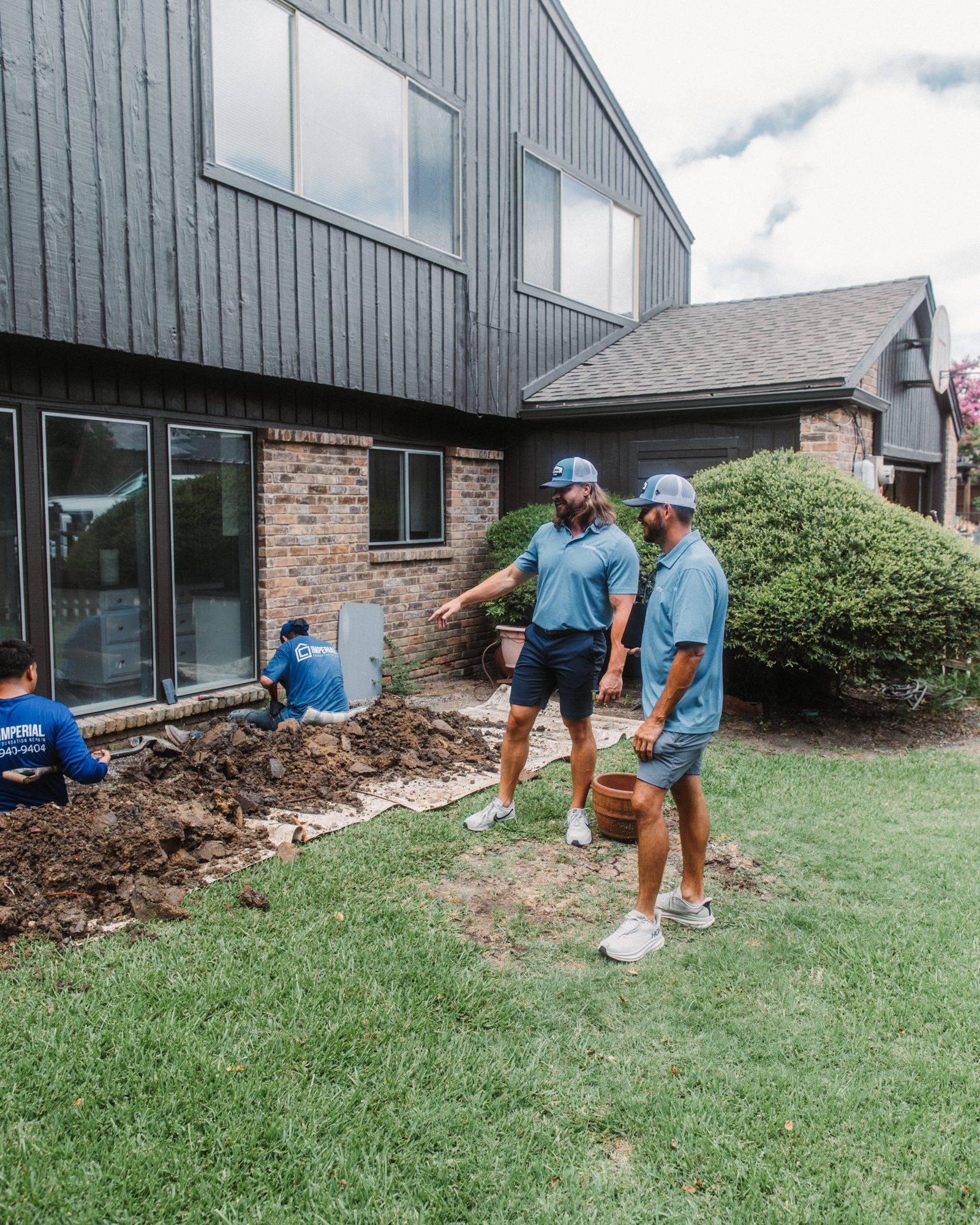 Rep and homeowner with crew, Imperial Foundation Repair job site in North Texas