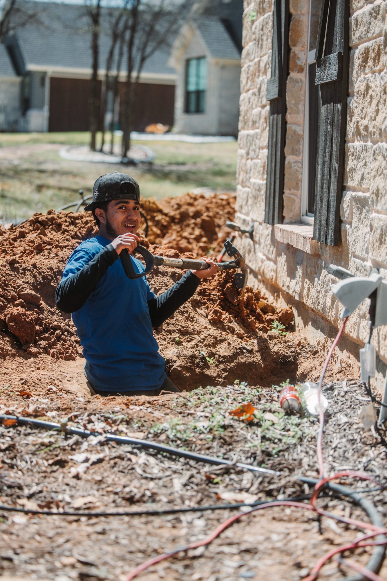 Crew in trench portrait, Imperial Foundation Repair job site in North Texas