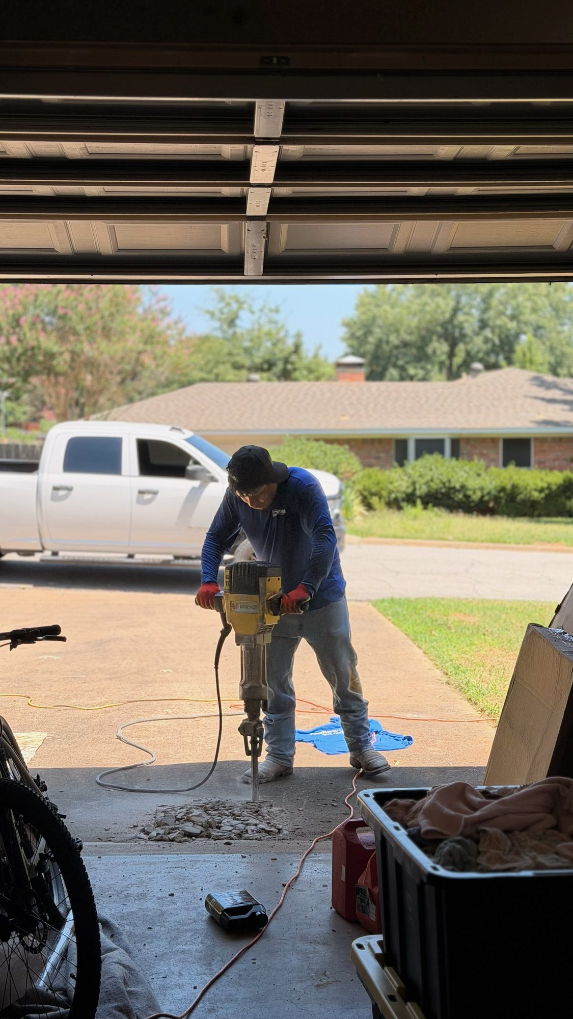 Jackhammer driveway, Imperial Foundation Repair job site in North Texas