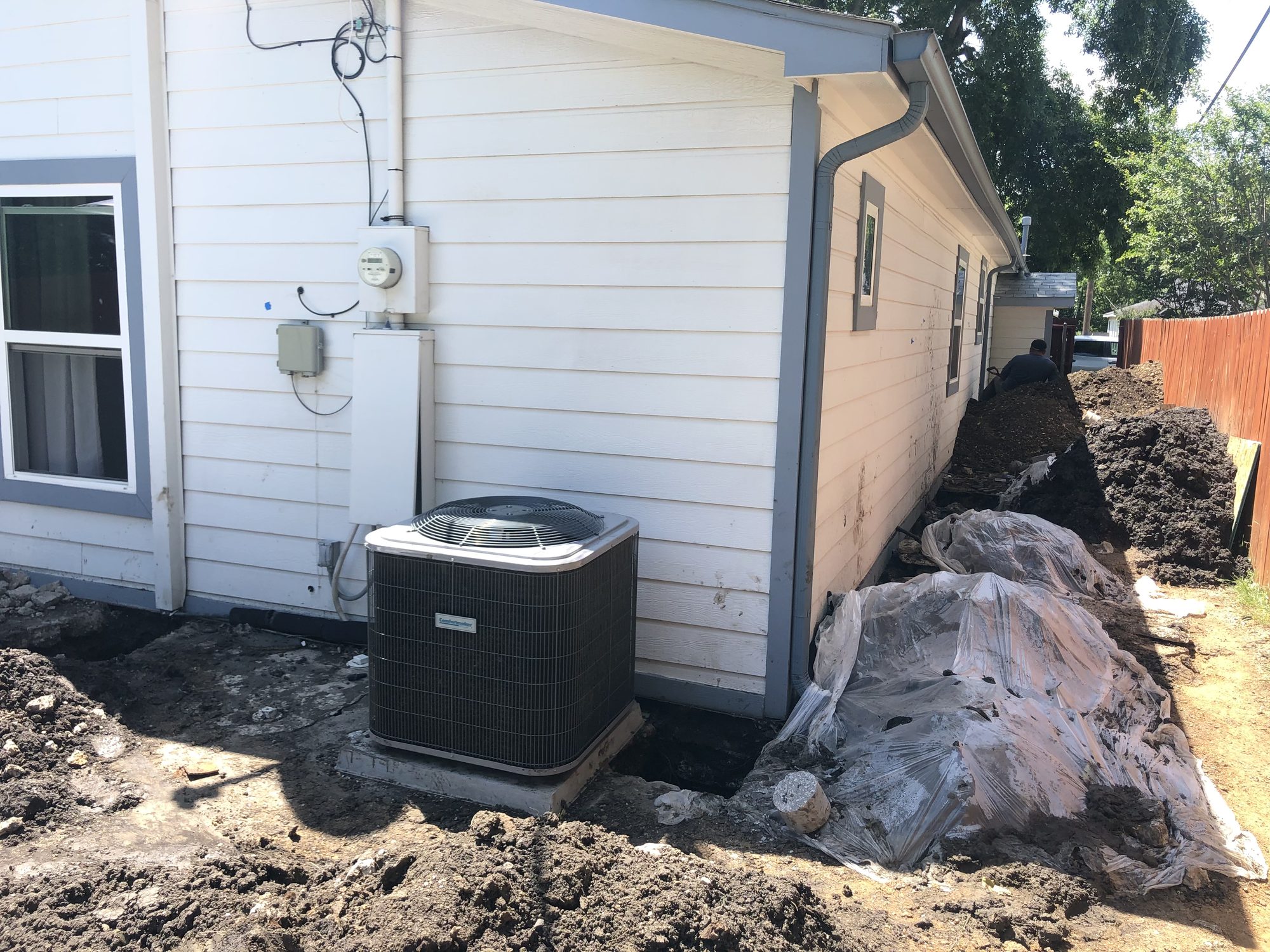 Excavation at AC unit, Imperial Foundation Repair job site in North Texas