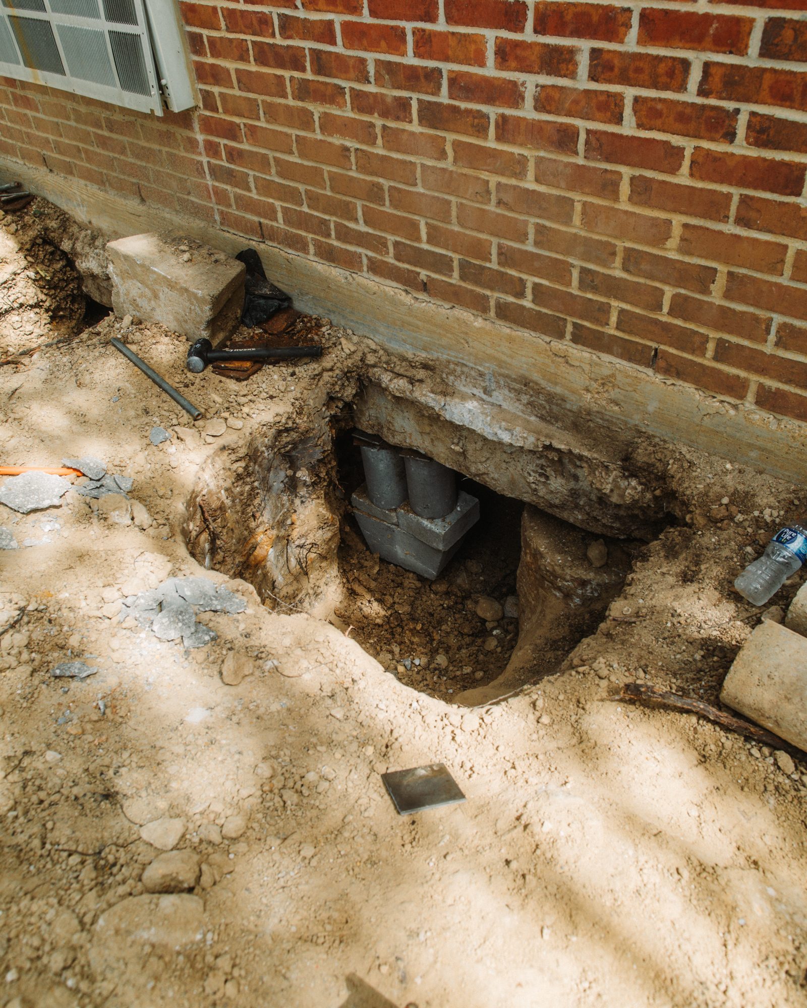 Concrete pier under footing, Imperial Foundation Repair job site in North Texas