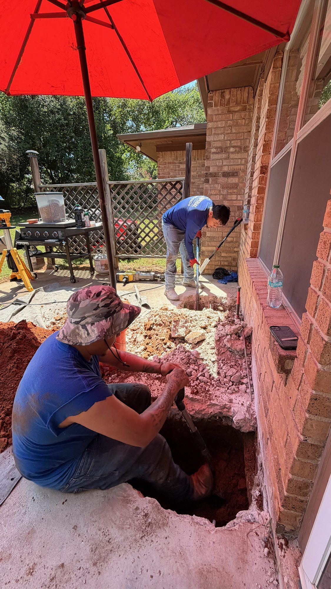 Patio pier hole dig, Imperial Foundation Repair job site in North Texas