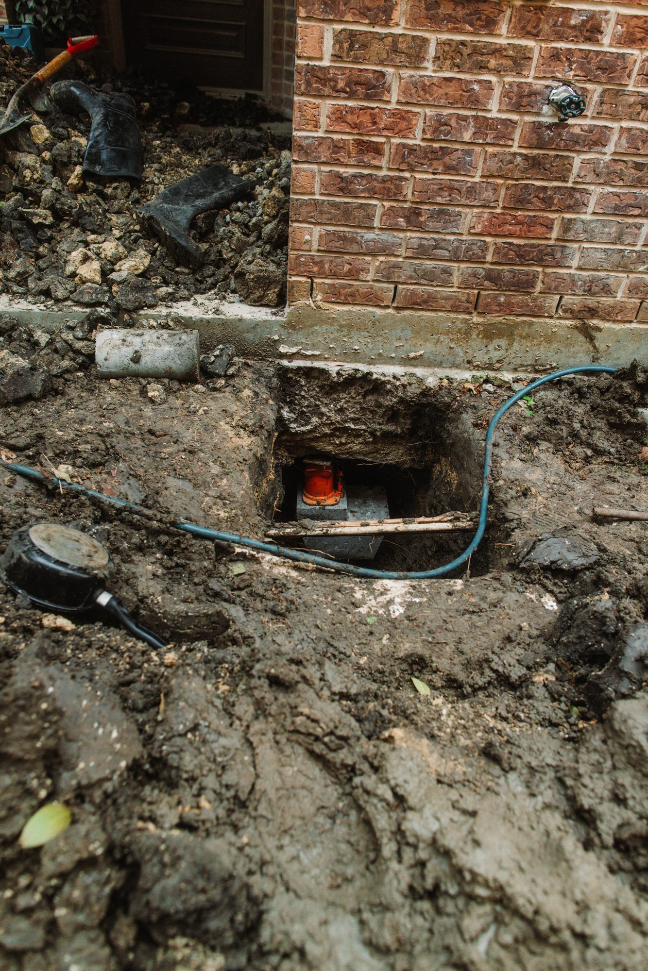 Pier hole hydraulic, Imperial Foundation Repair job site in North Texas