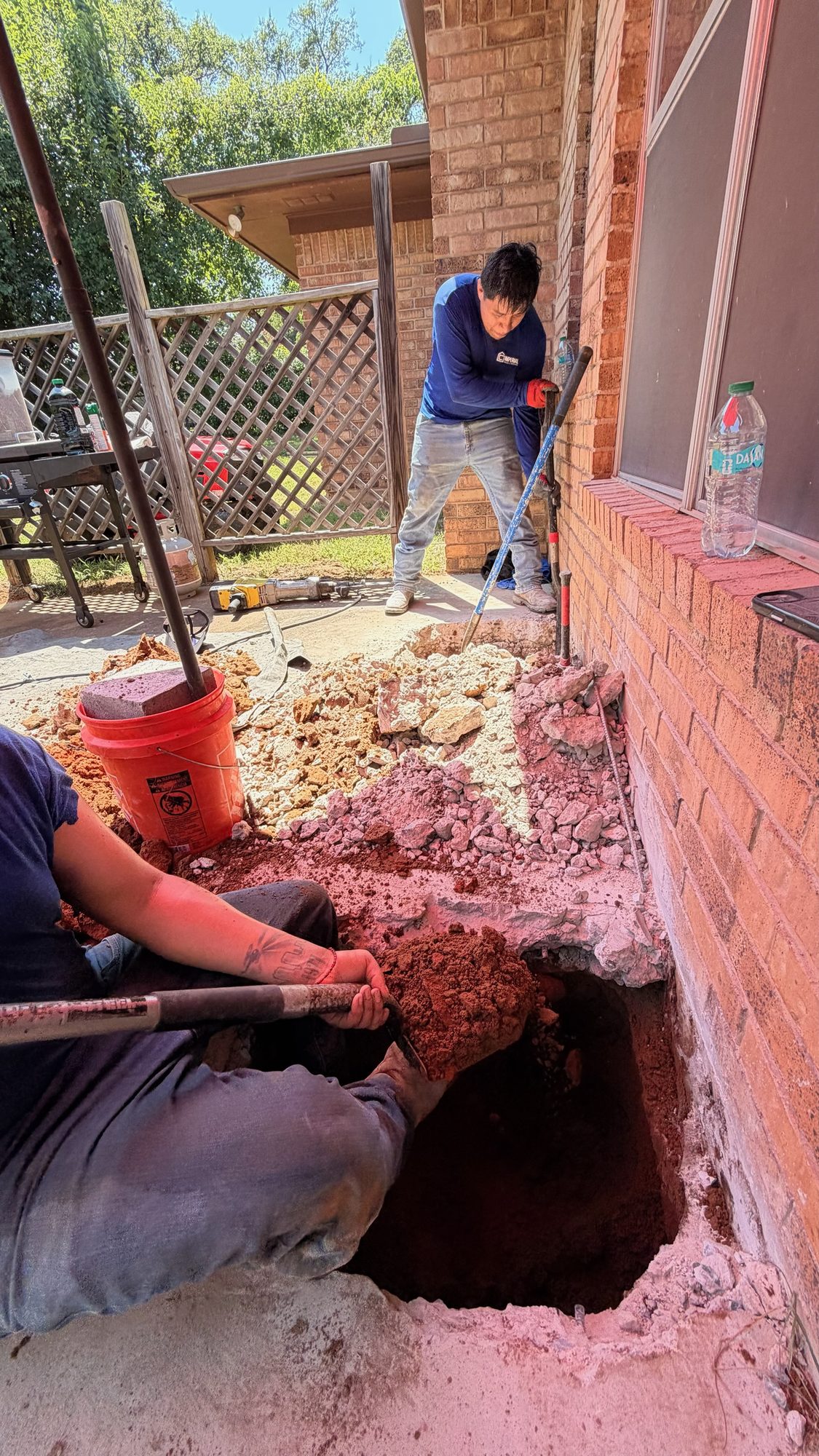 Patio pier hole dig, Imperial Foundation Repair job site in North Texas